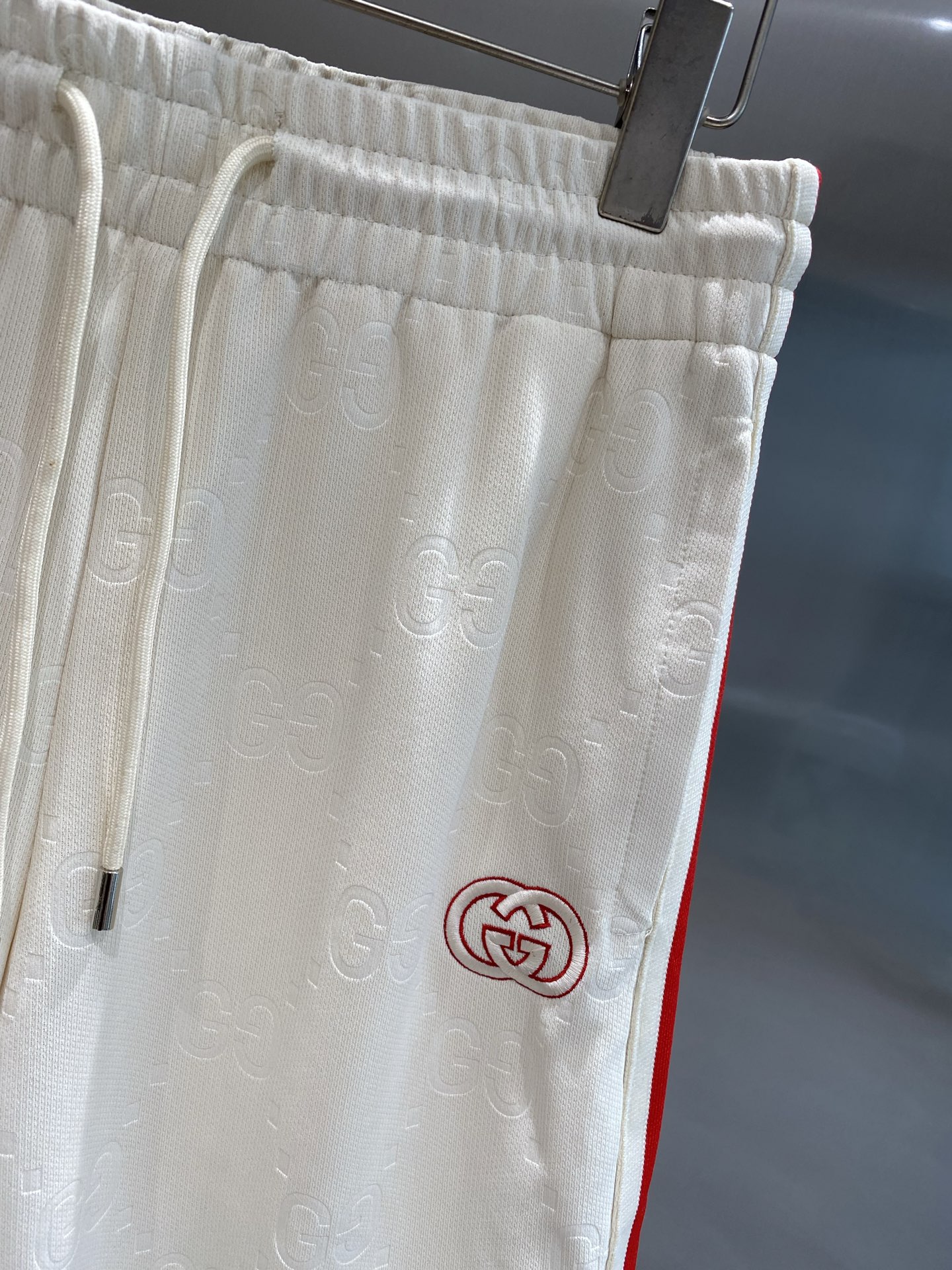 Red and white striped side panel shorts