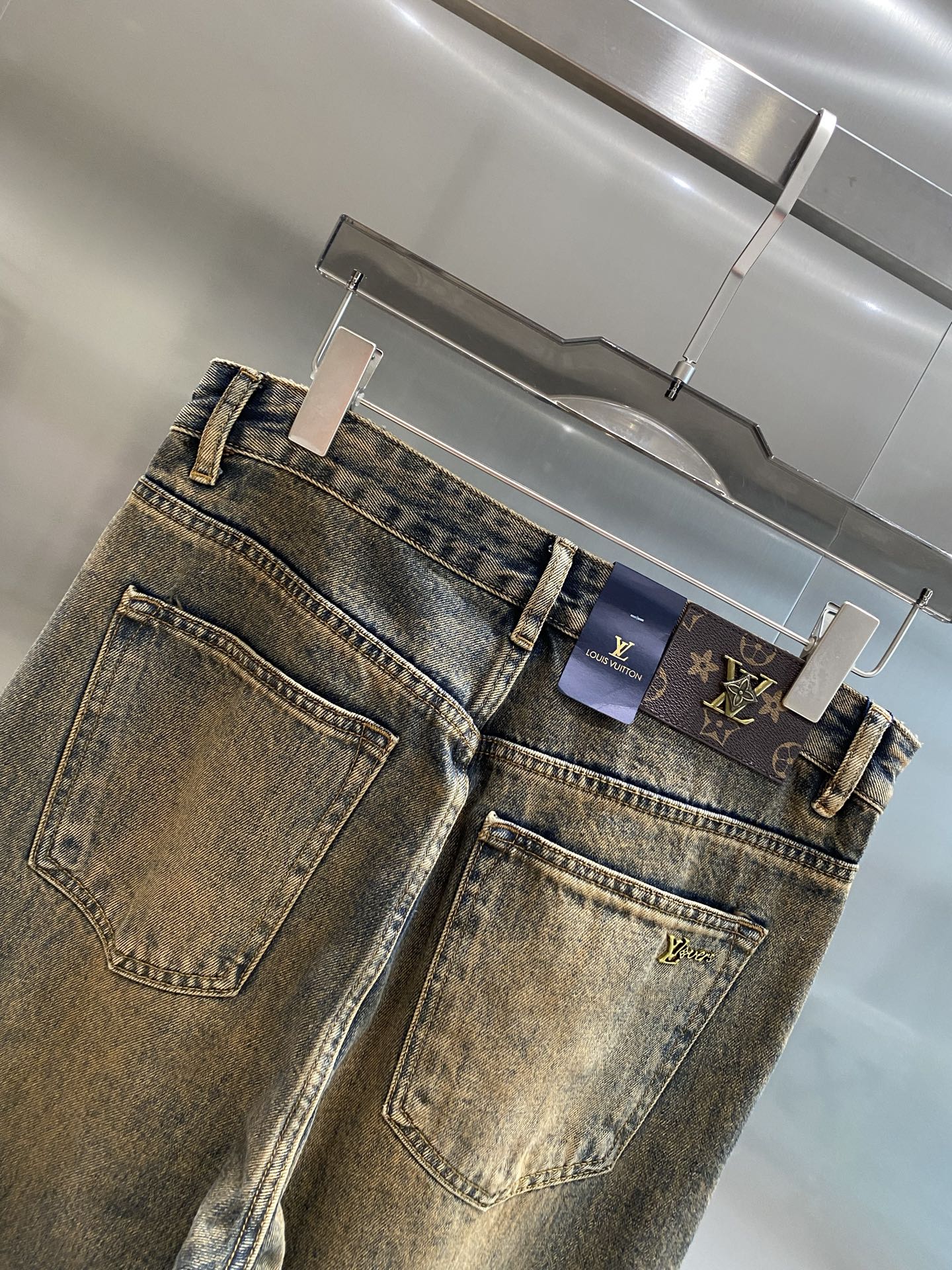 Distressed washed denim jeans