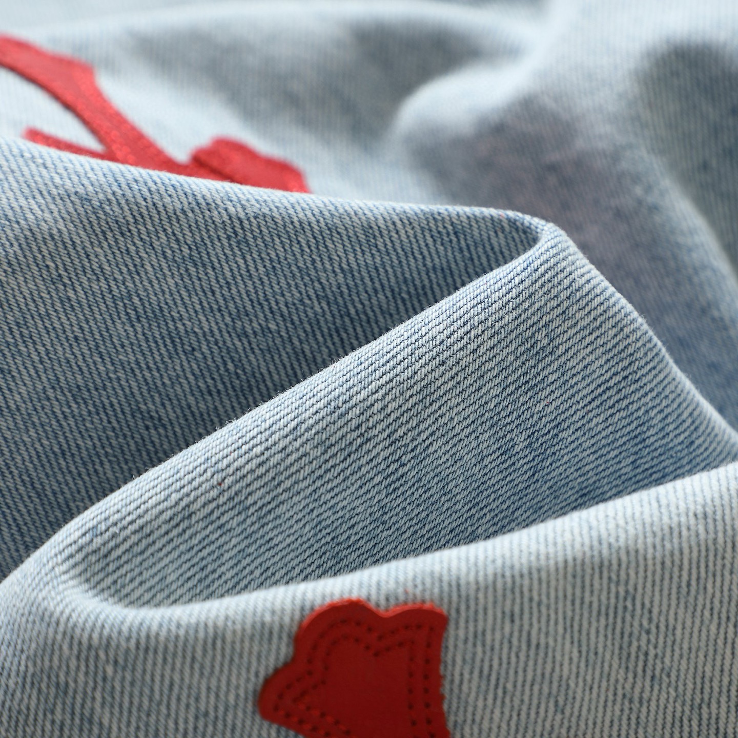 25SS Red Cross Patch Leather-Appliqué Jeans