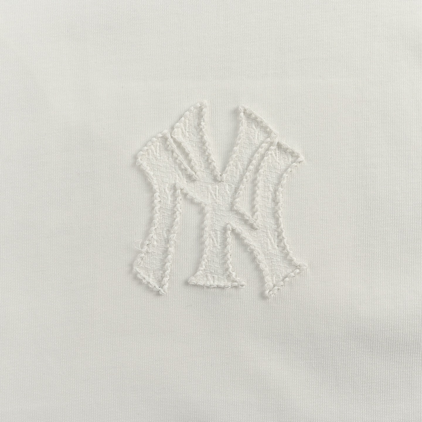 Back embroidered subtle pattern T-shirt