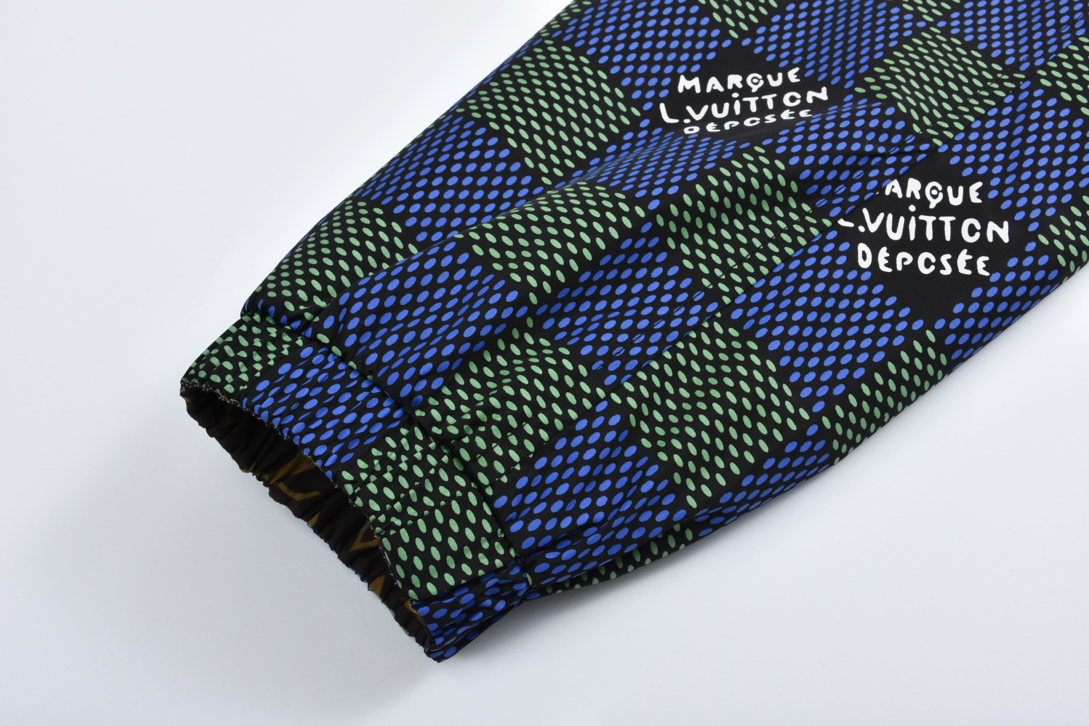 Checkerboard reversible zip-up jacket