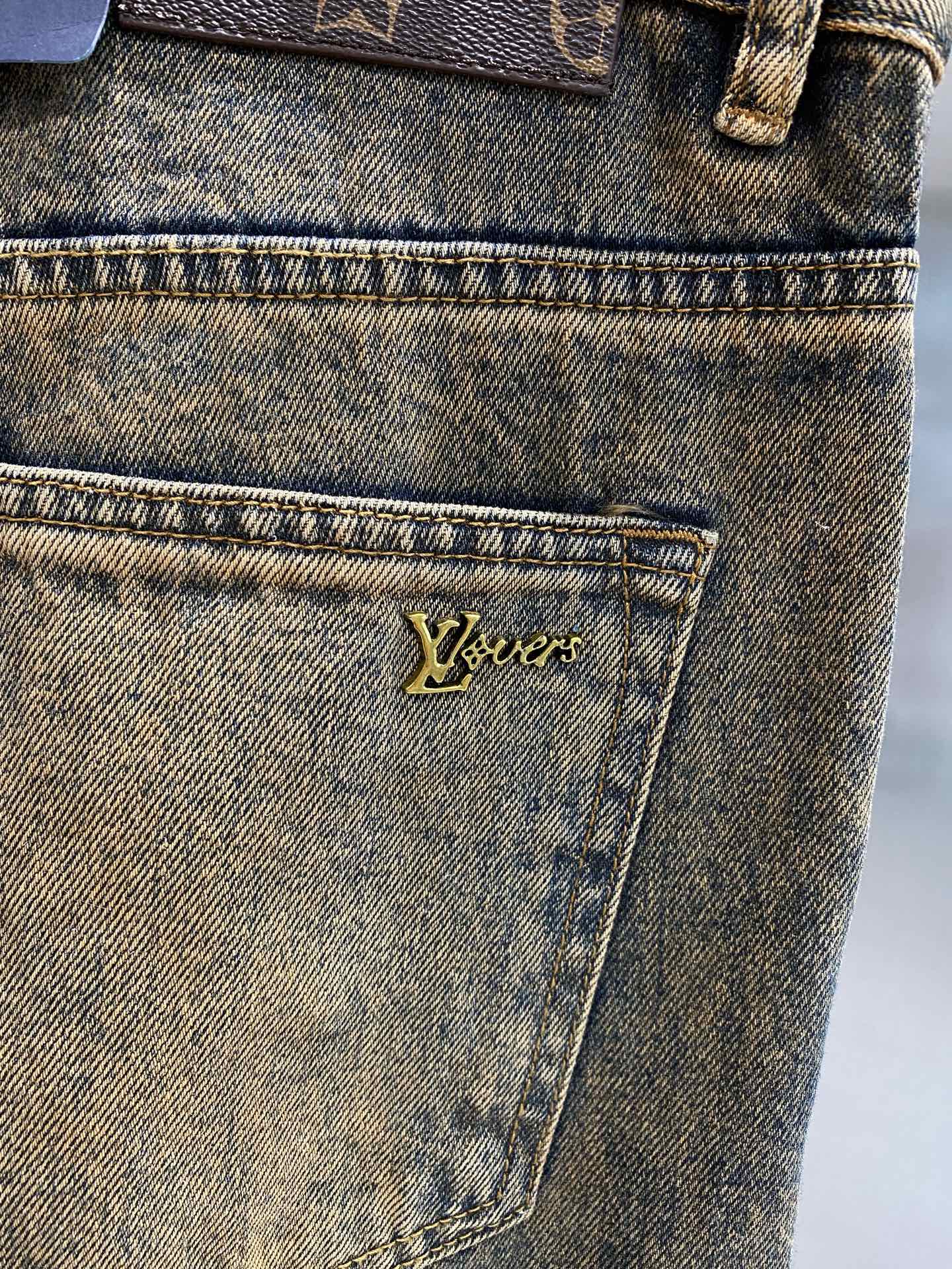 Distressed washed denim jeans