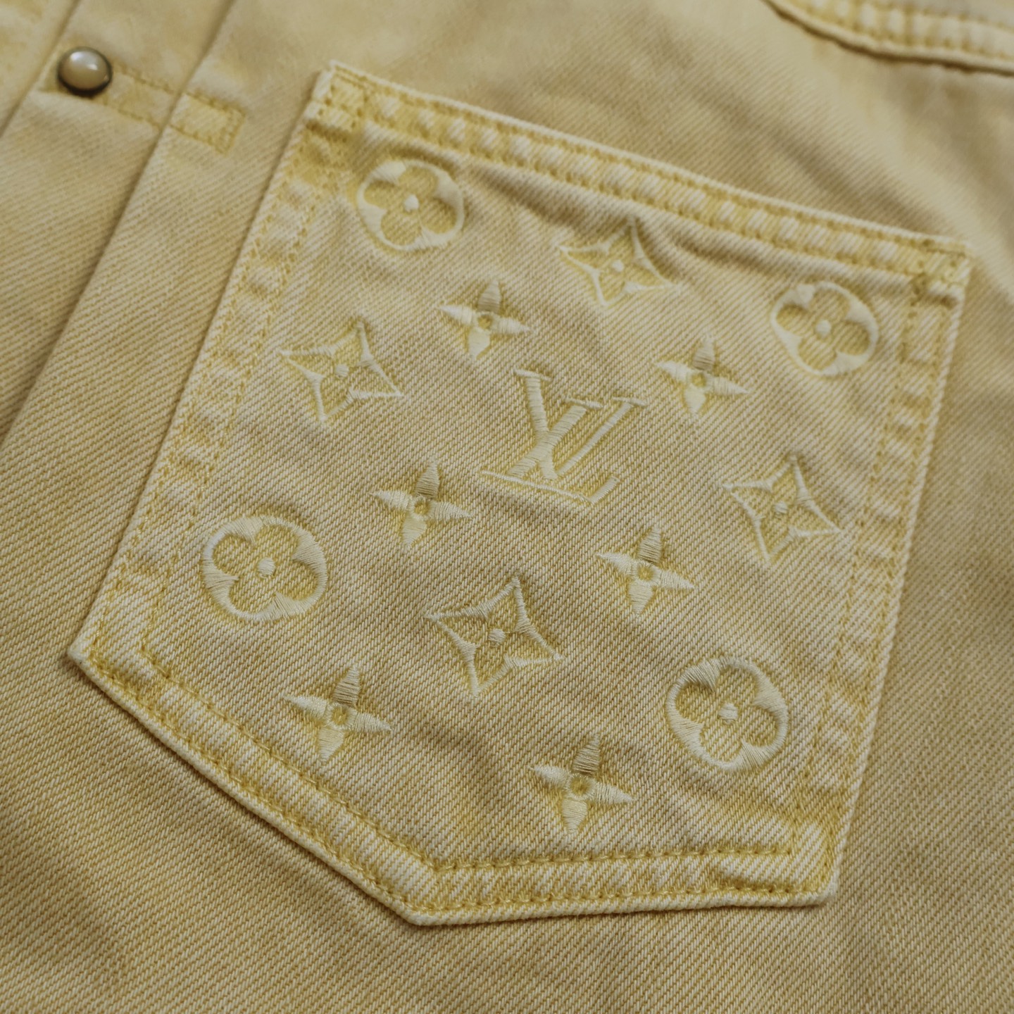 Denim jacket with embossed pockets