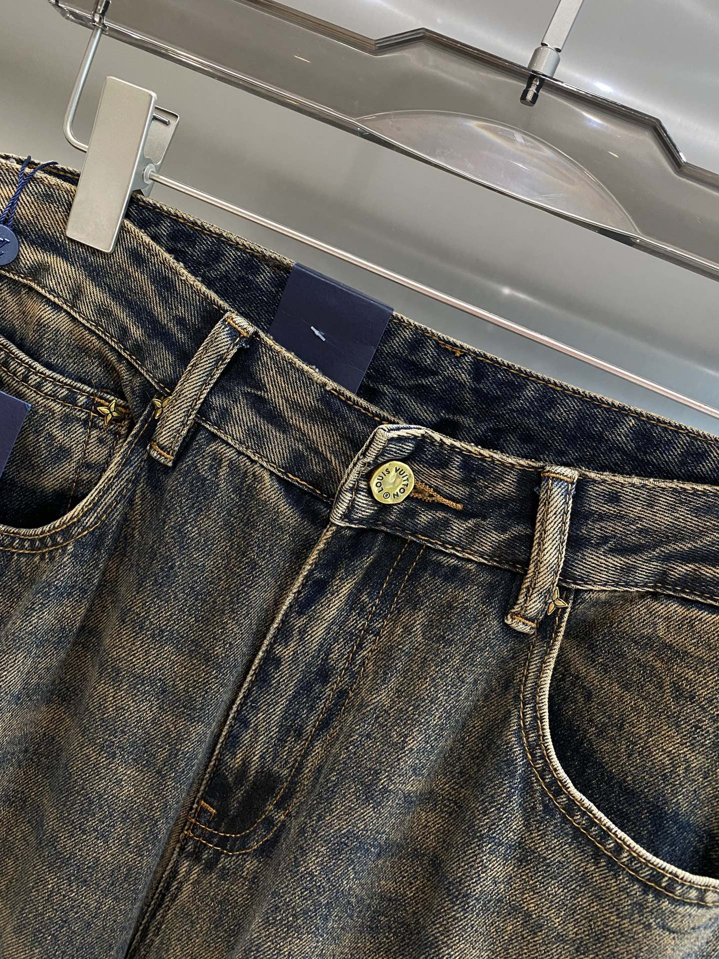 Distressed washed denim jeans