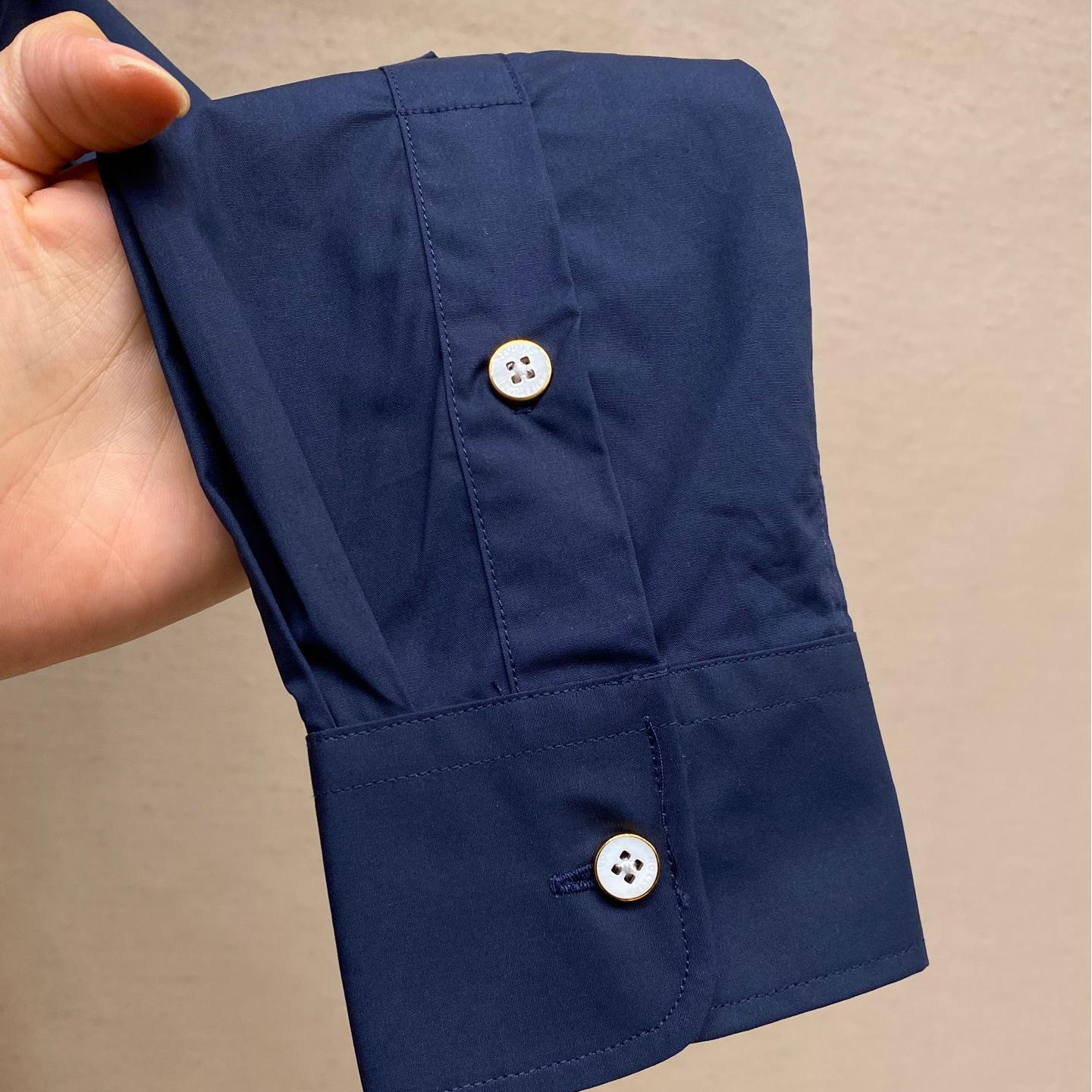 Blue shirt with co-branded signature print