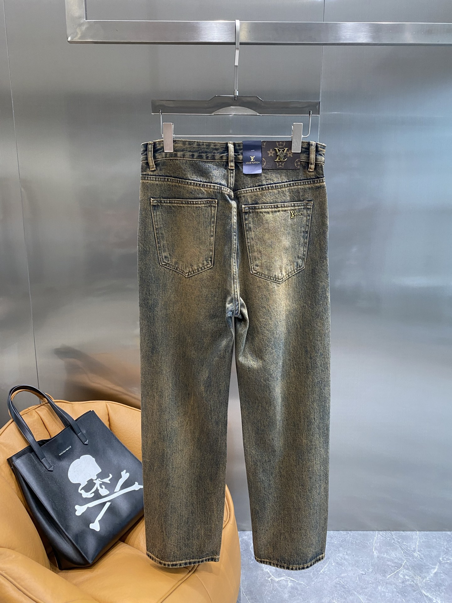 Distressed washed denim jeans