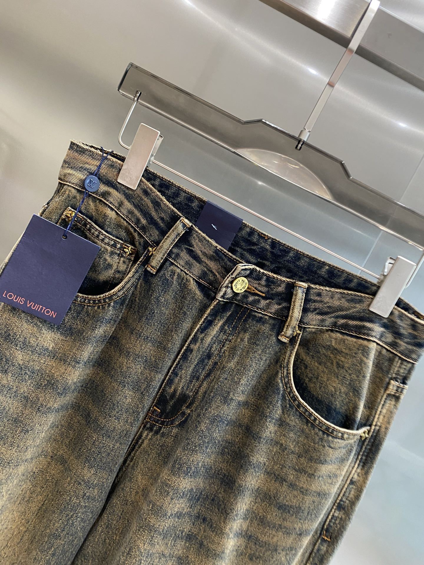 Distressed washed denim jeans