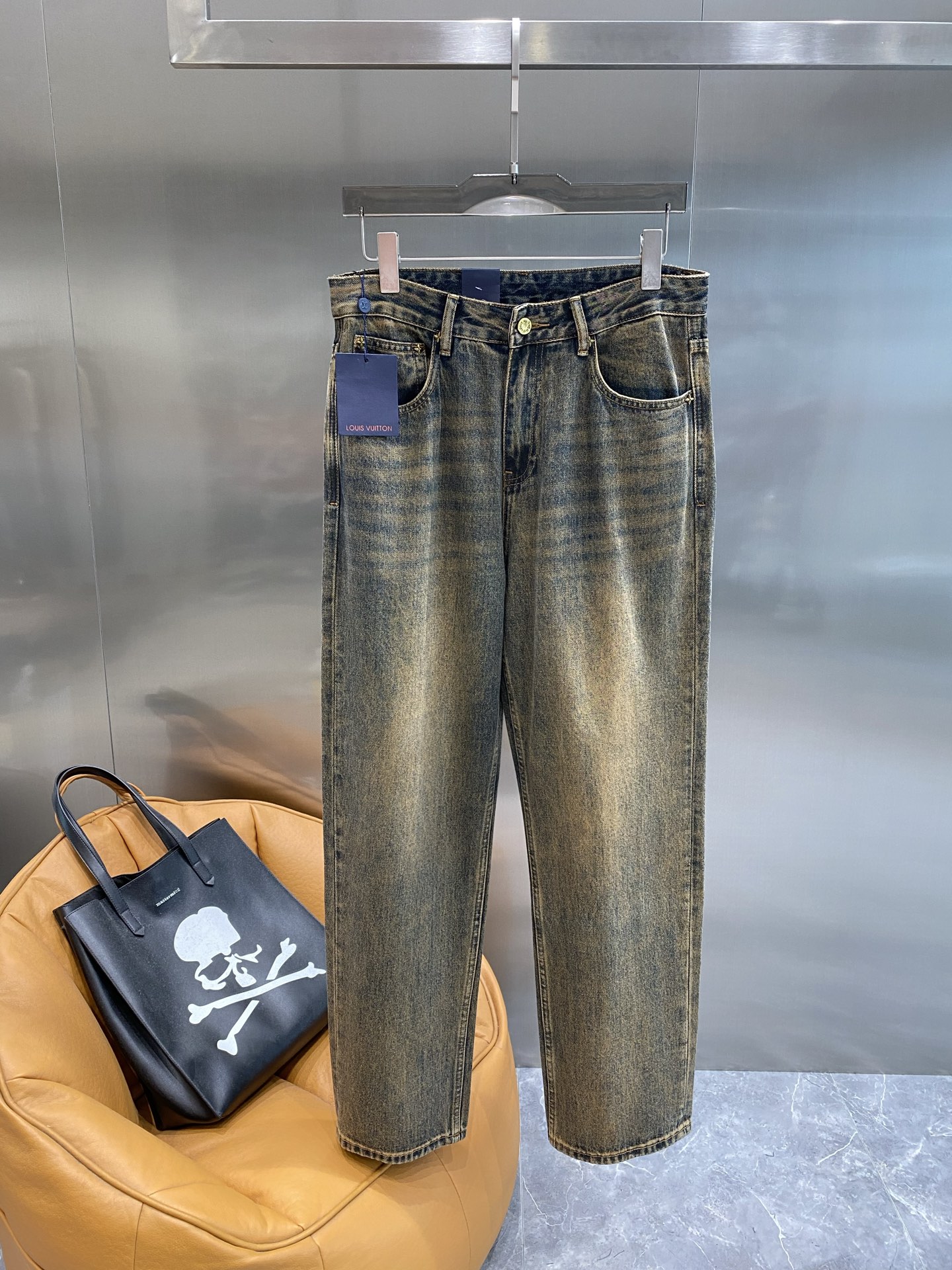 Distressed washed denim jeans