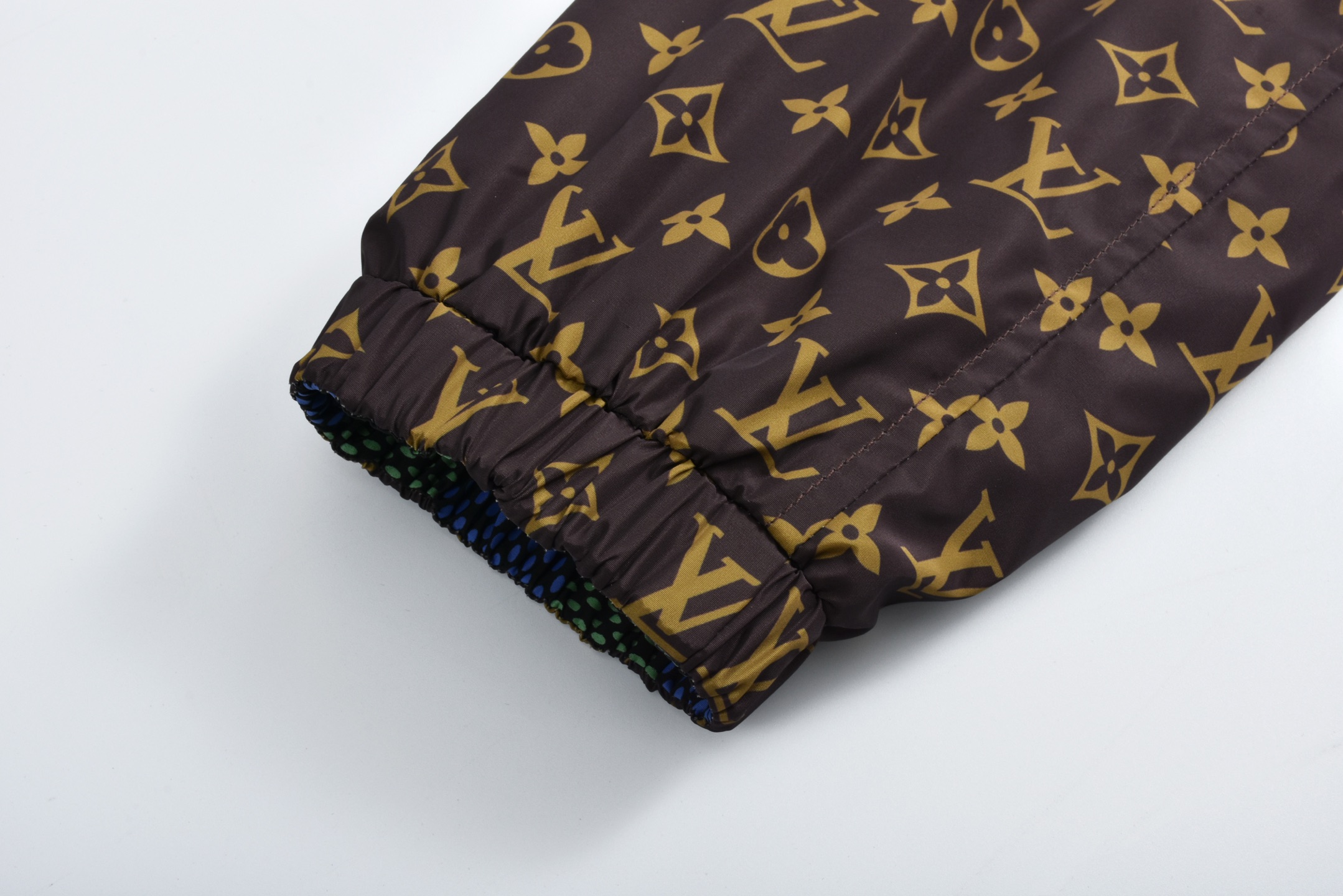 Checkerboard reversible zip-up jacket