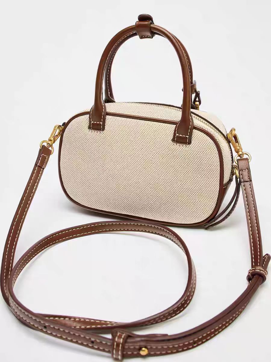 A niche retro contrasting handbag with a stylish cross body canvas small square bag and a single shoulder bowling bag