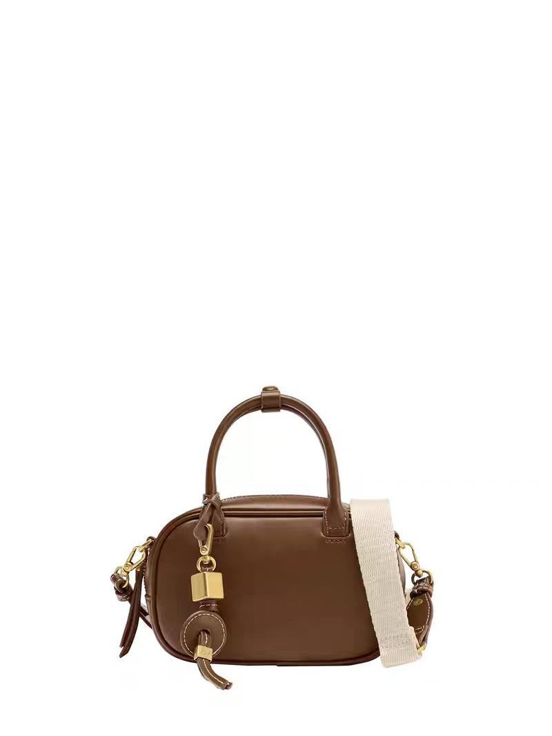 A niche retro contrasting handbag with a stylish cross body canvas small square bag and a single shoulder bowling bag