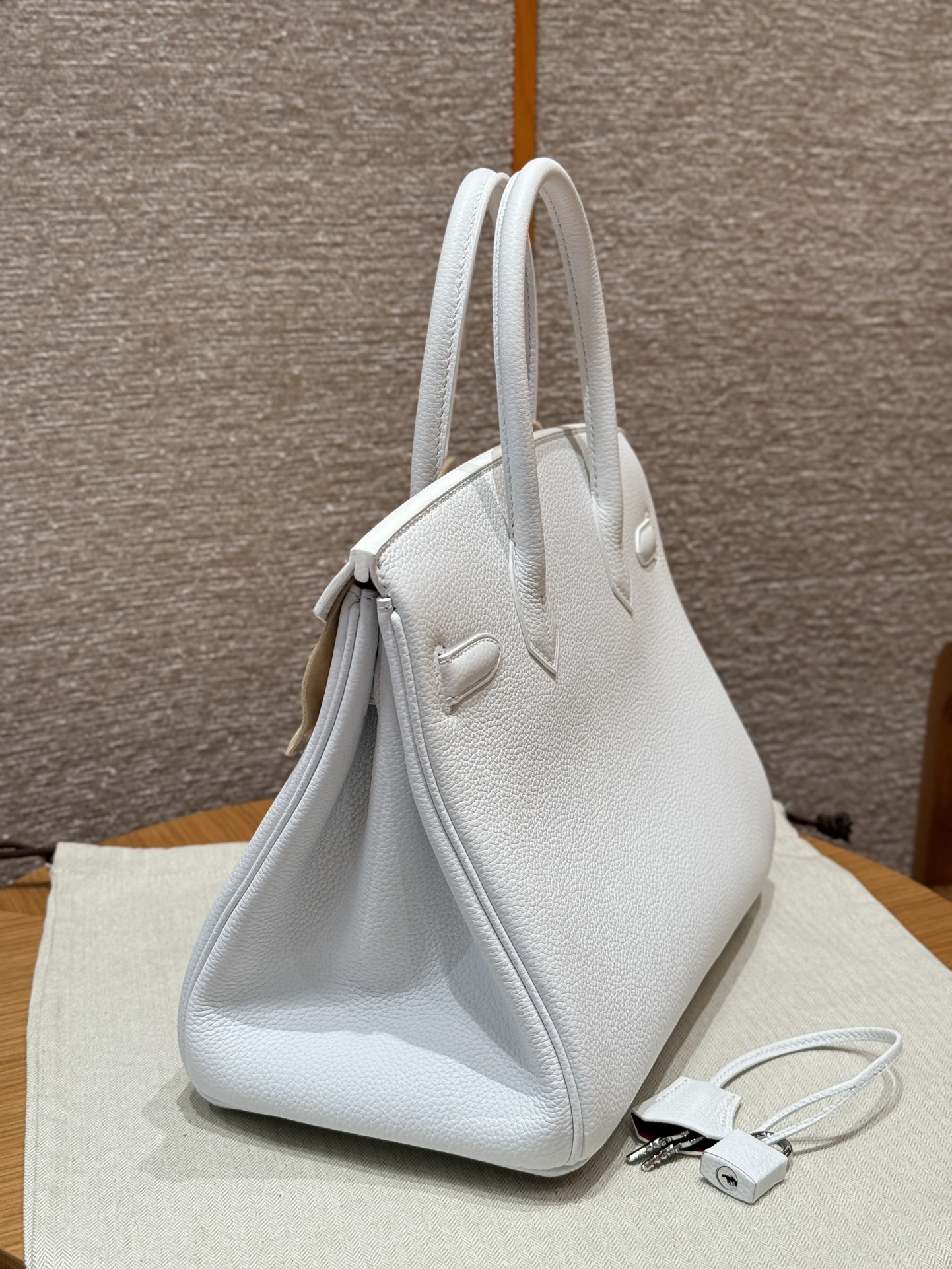 Hermès Birkin 30 white exterior and poppy orange lining