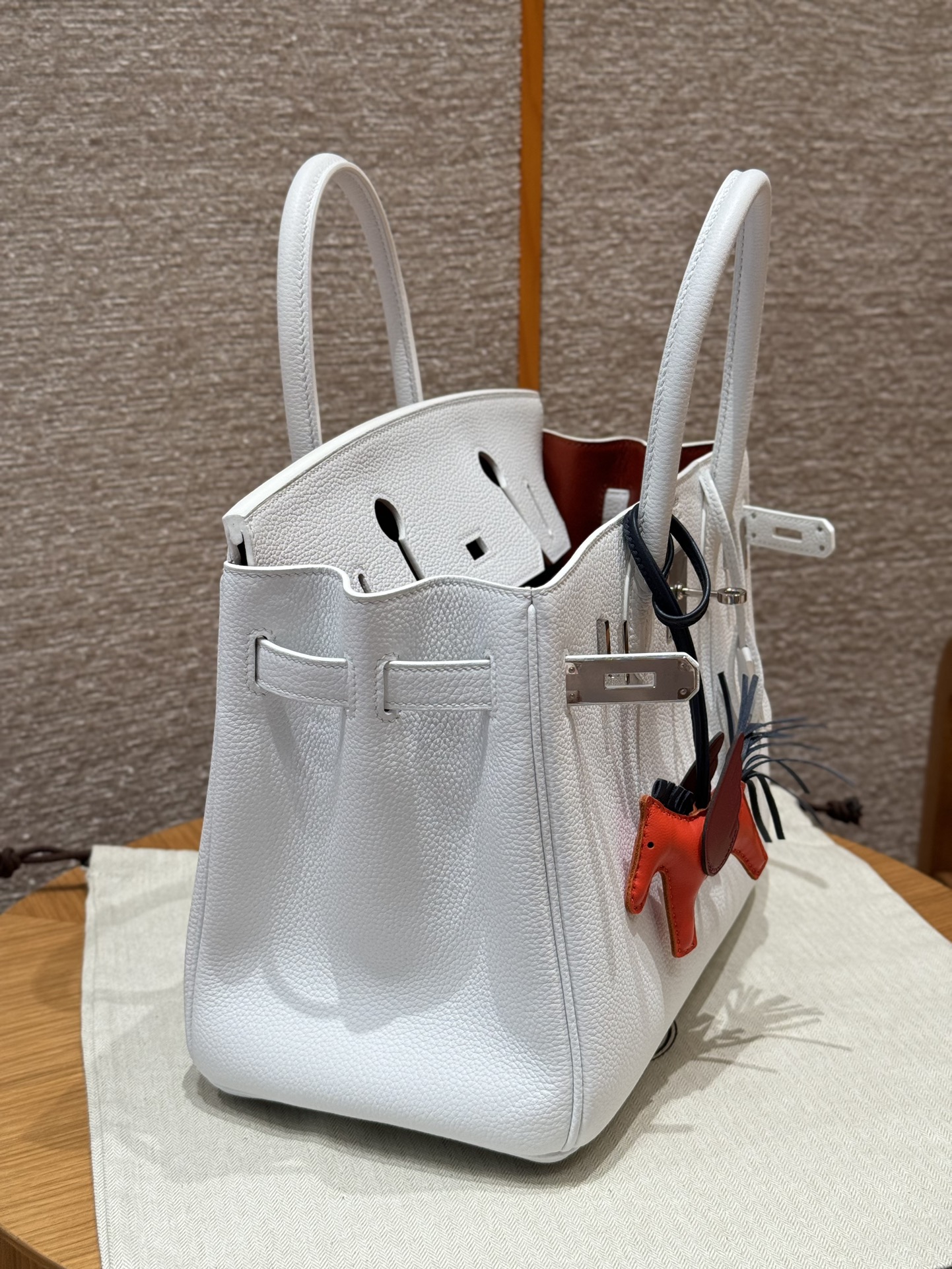 Hermès Birkin 30 white exterior and poppy orange lining