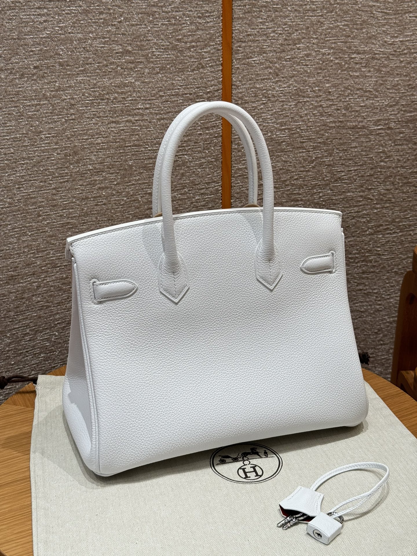 Hermès Birkin 30 white exterior and poppy orange lining