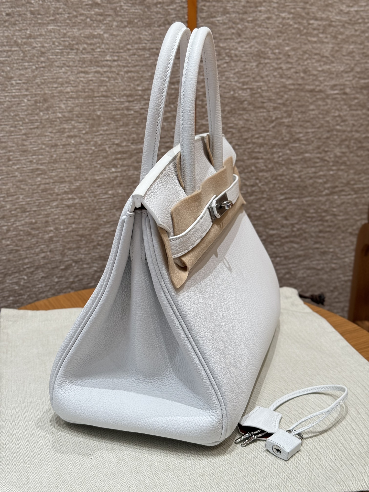 Hermès Birkin 30 white exterior and poppy orange lining