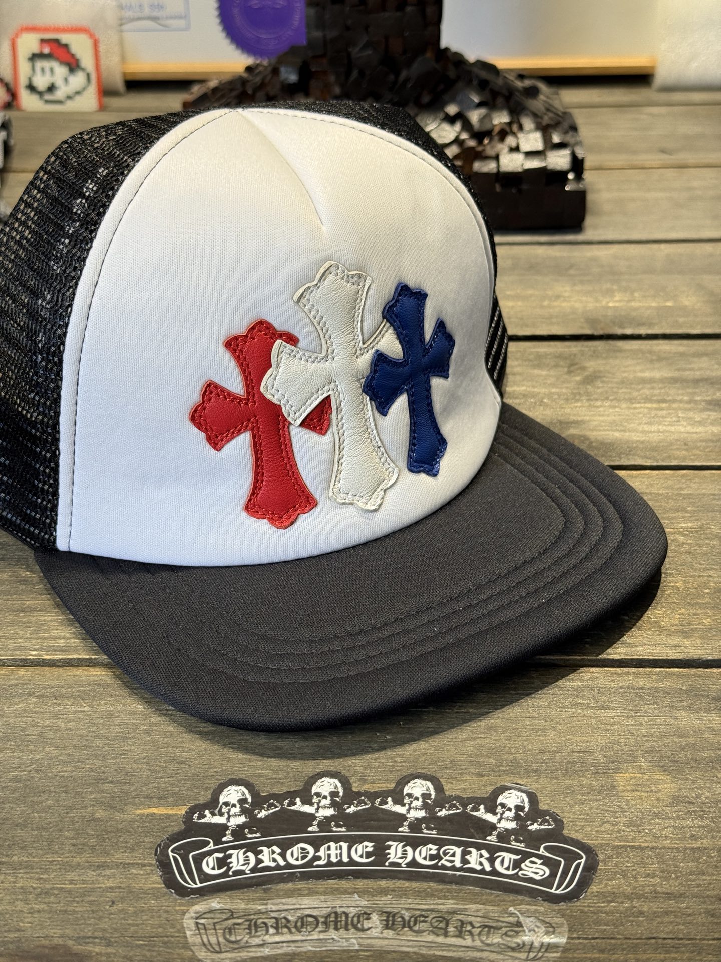 Custom-ordered 30-cross baseball cap with sterling silver buckle and premium car emblem.