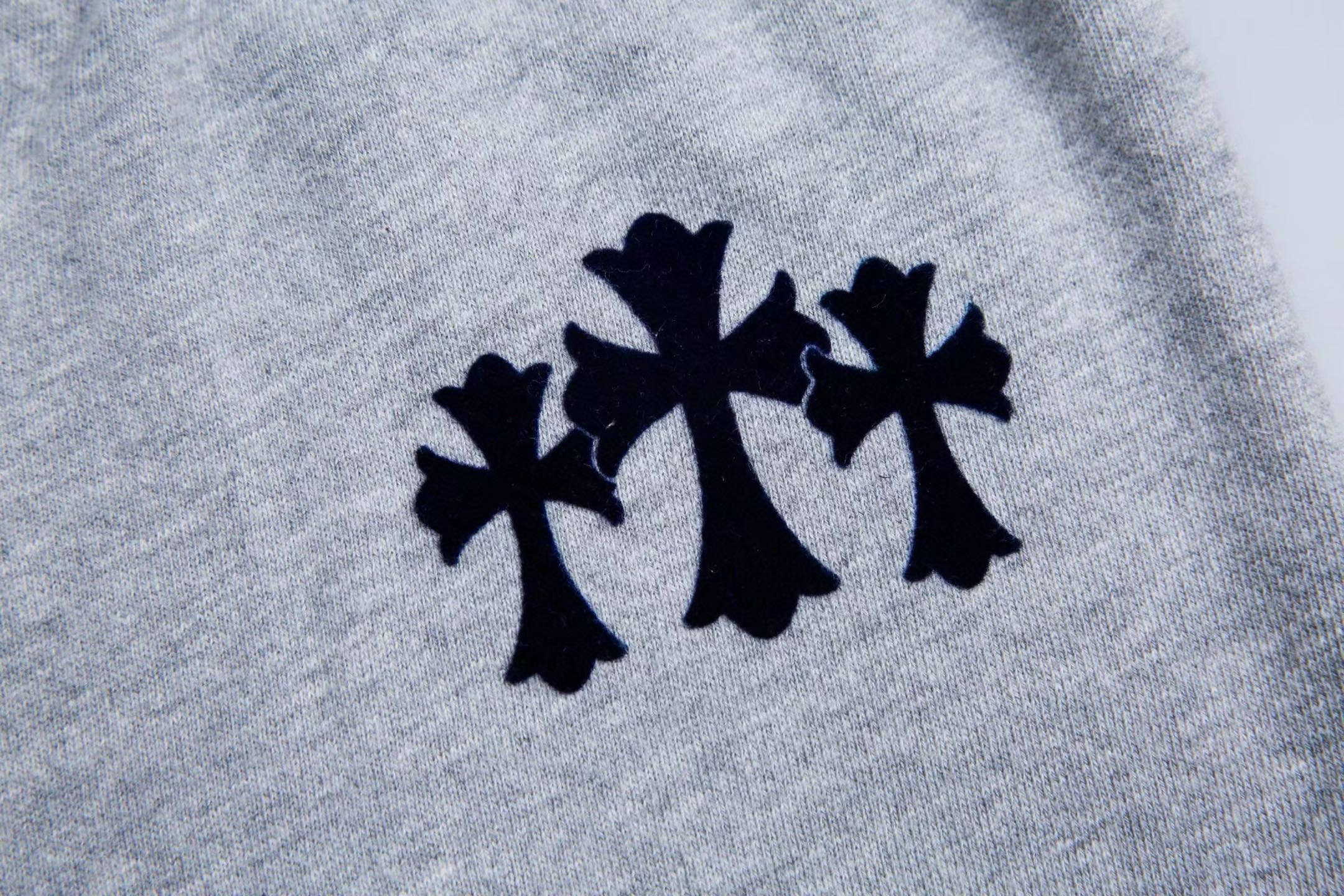 Chrome Hearts Grey Flocked Three-Cross Casual Sweatpants. Made of custom-woven and dyed chunky knit loose fabric, segmented cut. Uses the same electrostatic flocking process as the original garment, not the usual die-cut process; the color may vary d