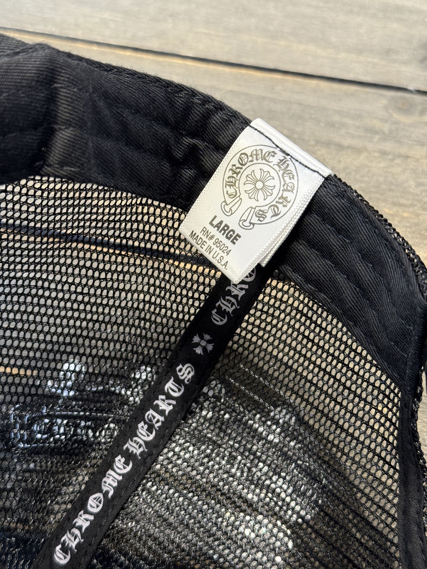 Custom-ordered 30-cross baseball cap with sterling silver buckle and premium car emblem.