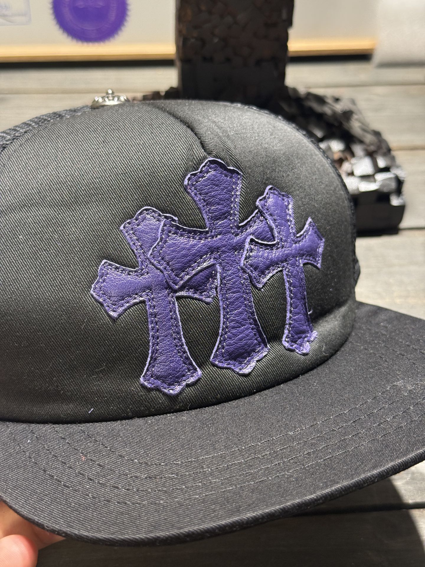 Custom-ordered 30-cross baseball cap with sterling silver buckle and premium car emblem.