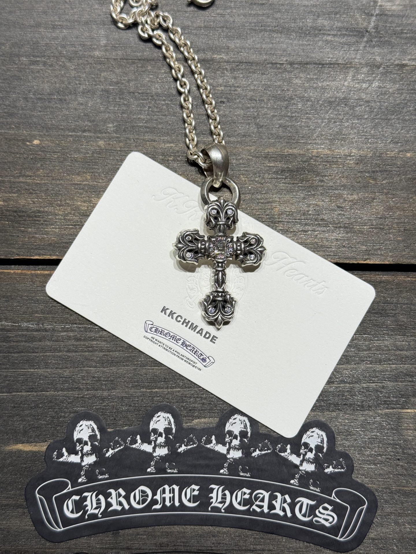 Custom-made for our client: Medium-sized flame cross necklace with full VVS diamond setting and lobster chain, featuring top-tier setting and engraving craftsmanship.