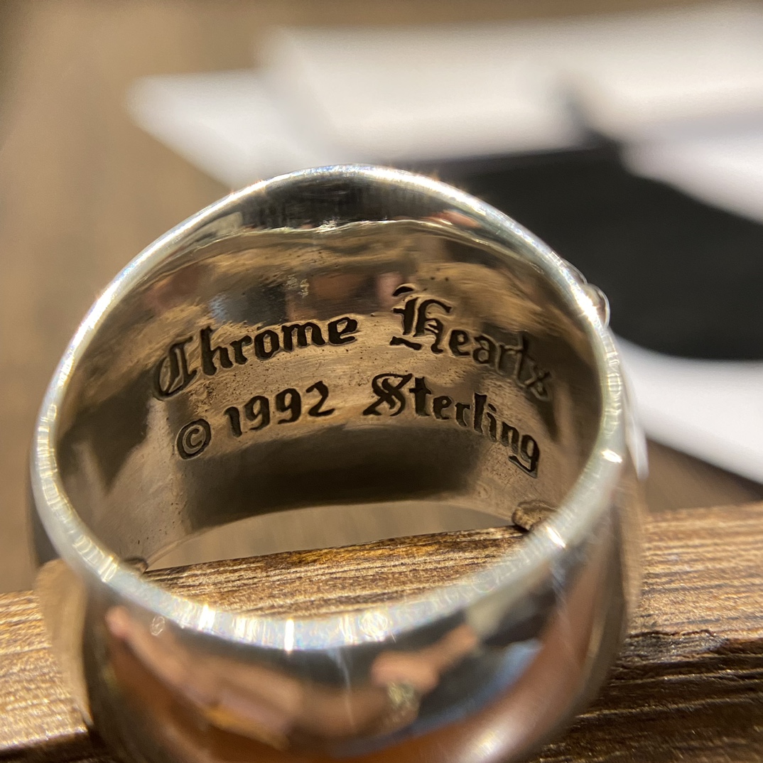 Chrome HeartsTop-quality domestic version of the wide Guardian ringAuthentic design, genuine-grade distressed engraving, anodized textureA high-volume seller daily; the craftsmanship and details speak for themselvesThis Guardian ring, in term