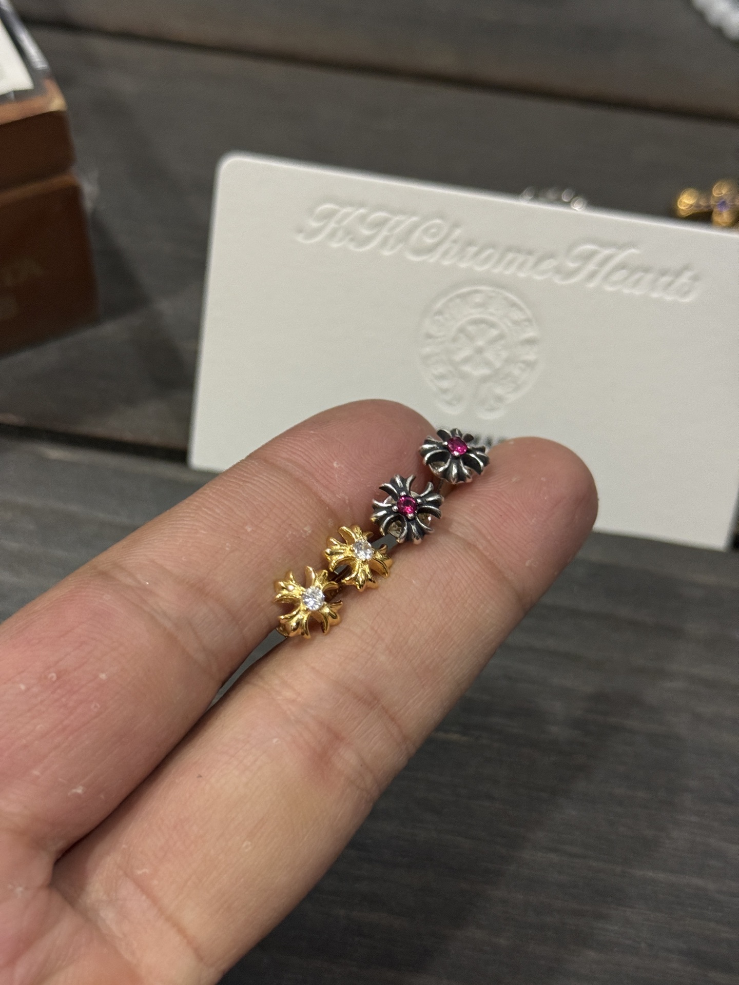 Ordered 22k gold diamond & red diamond square cross earrings