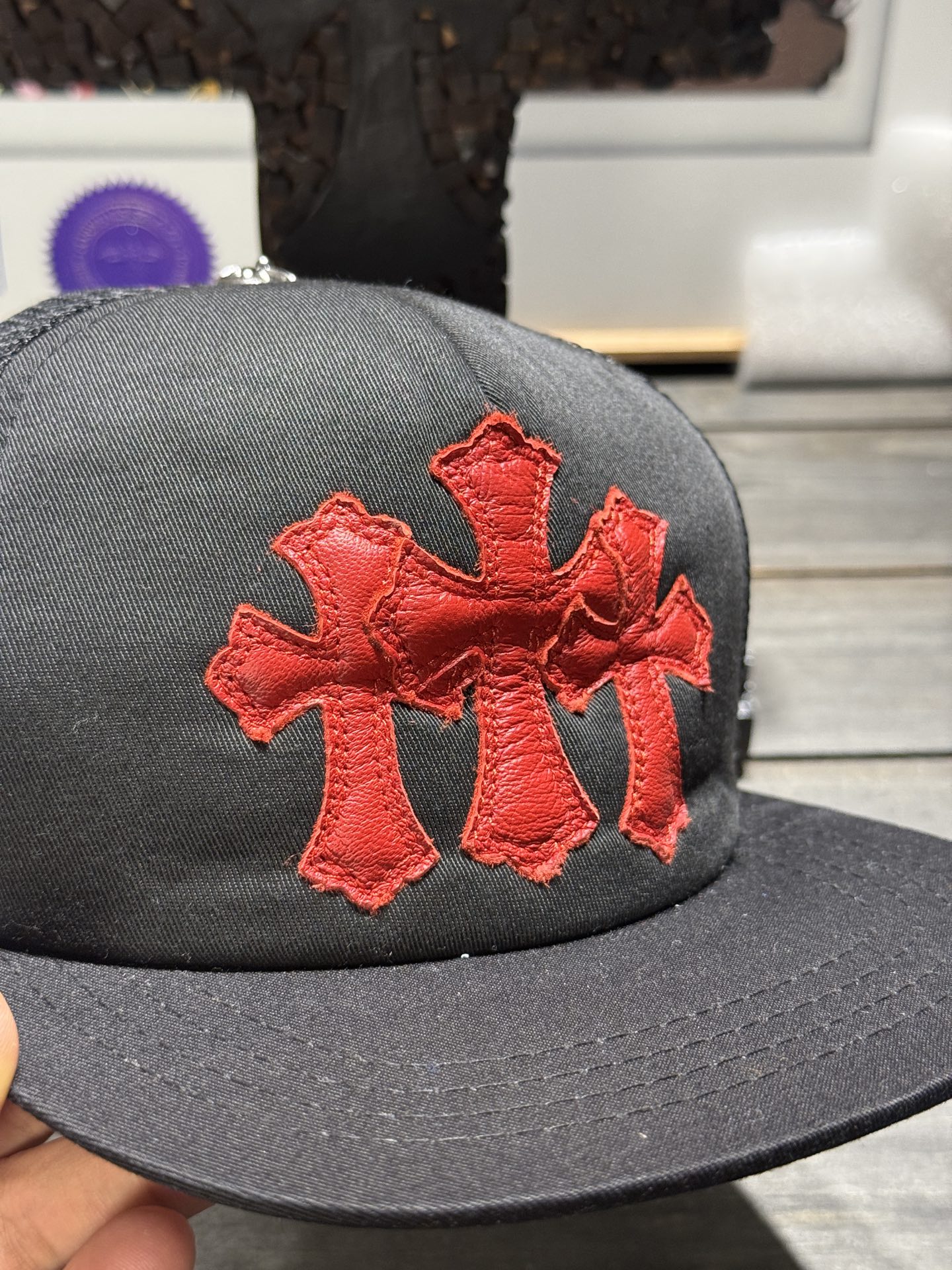 Custom-ordered 30-cross baseball cap with sterling silver buckle and premium car emblem.