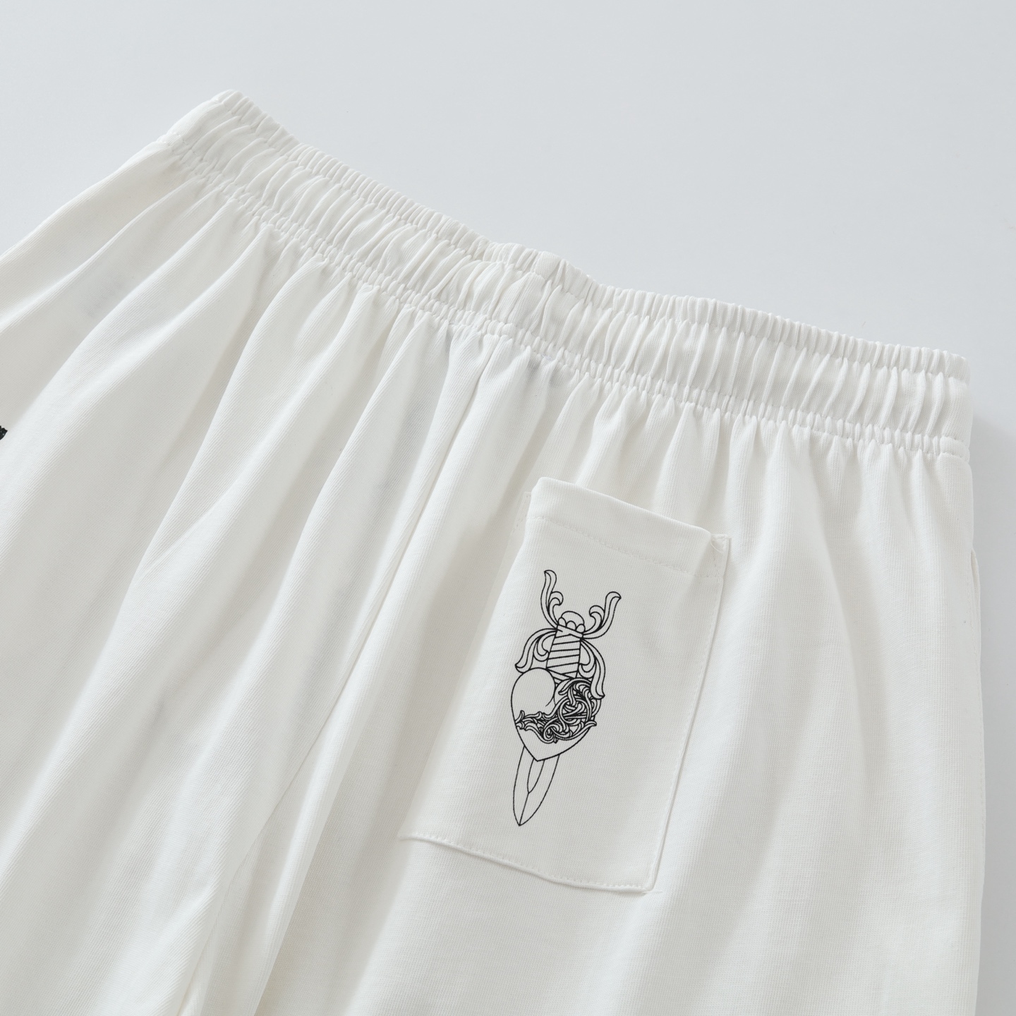CH DeadlyDoll comic book trousers, white. All sizes available. Originally purchased from Hangzhou Guozhuan for 12,800 RMB. Made of 350g knitted cotton. Printed with imported plastisol technology. Custom metal drawstring closure. Loose fit. Unisex. Ex