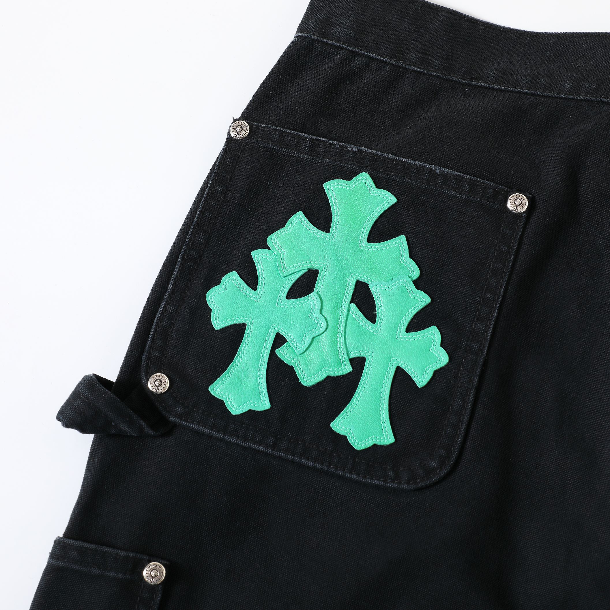 CH Distressed Carhart Style Work Pants with Green Leather PatchesThe fabric is a high-density, high-count, high-resin reactive black cotton Juvan.The fabric's high thread count and density give it a three-dimensional look.It's thick yet soft an