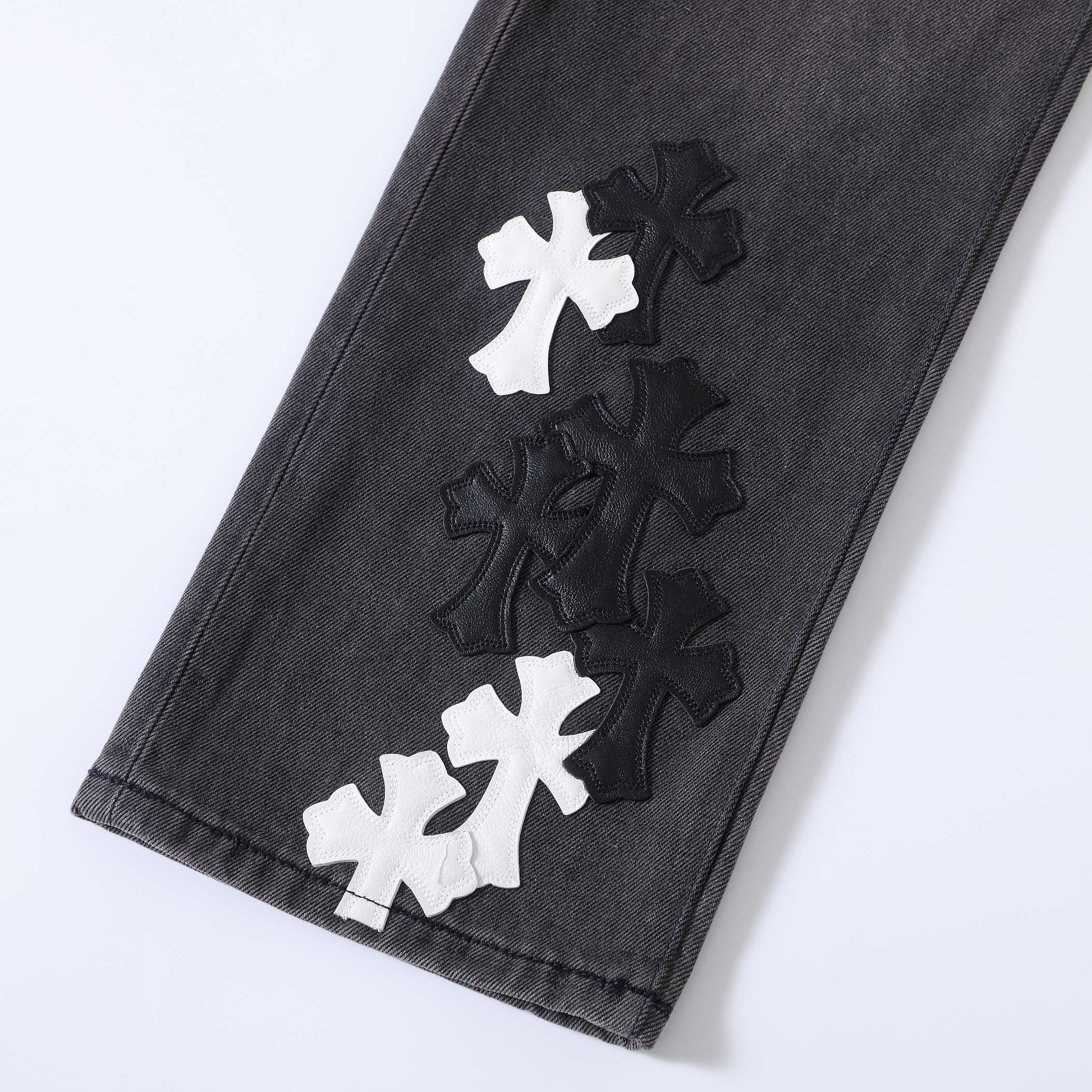 CH Flame Knee Design, Black and White Leather. Custom-made fabric, original jacquard lining, embroidery. Knee flame design perfectly replicated. Made with dozens of genuine leather crosses. Extremely high cost, significant wastage, and high labor cos