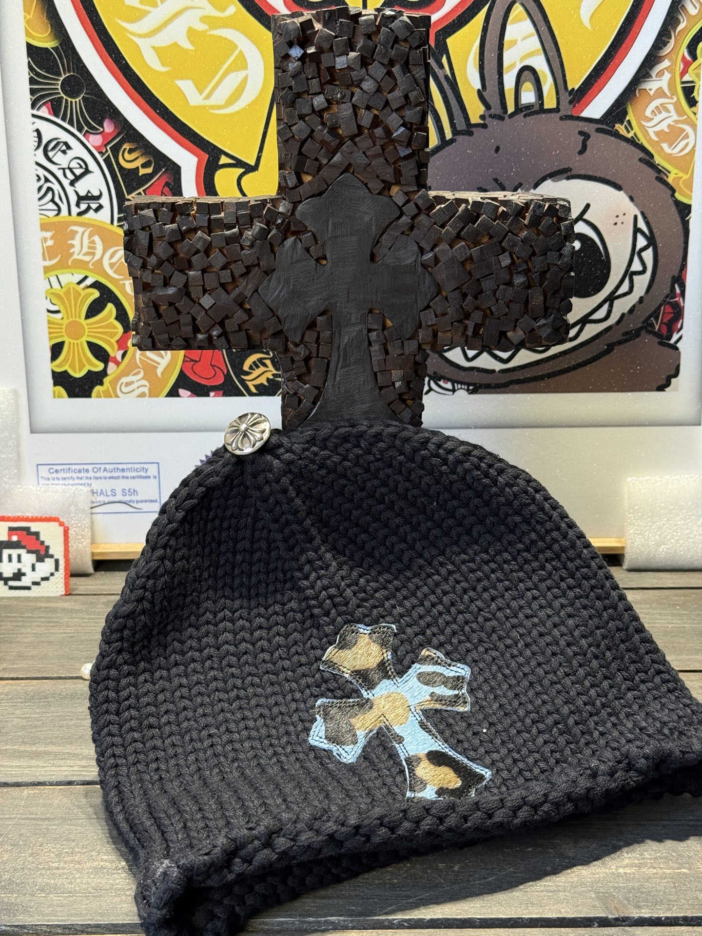 Custom-ordered leopard print cross beanie with sterling silver buckle and premium car emblem.
