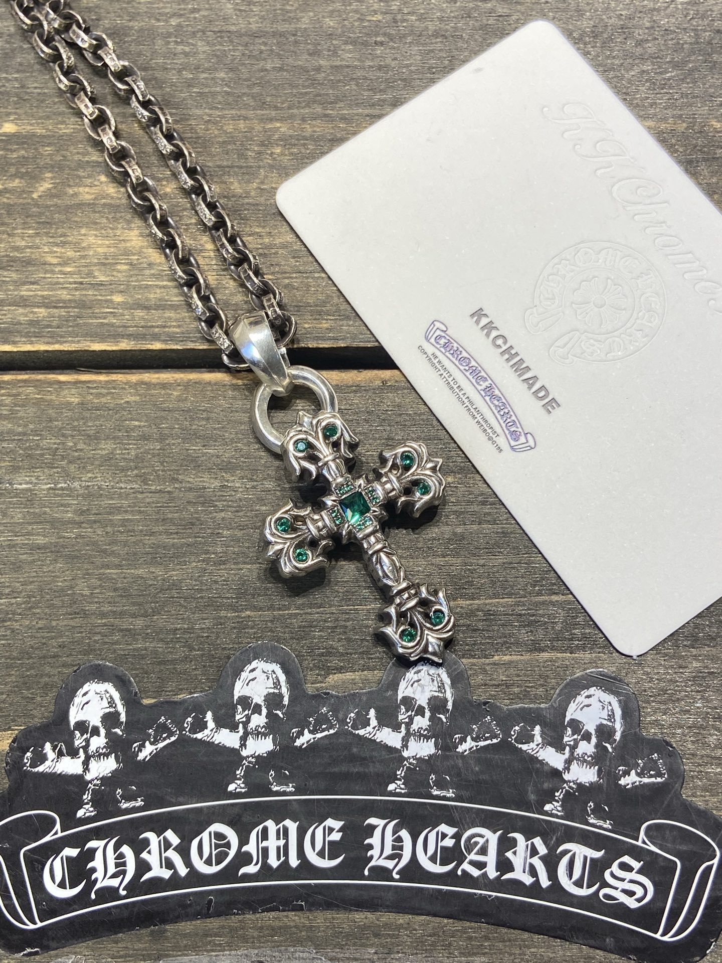 Customer order: Medium-sized flame cross necklace with green diamond setting + PP letter chain