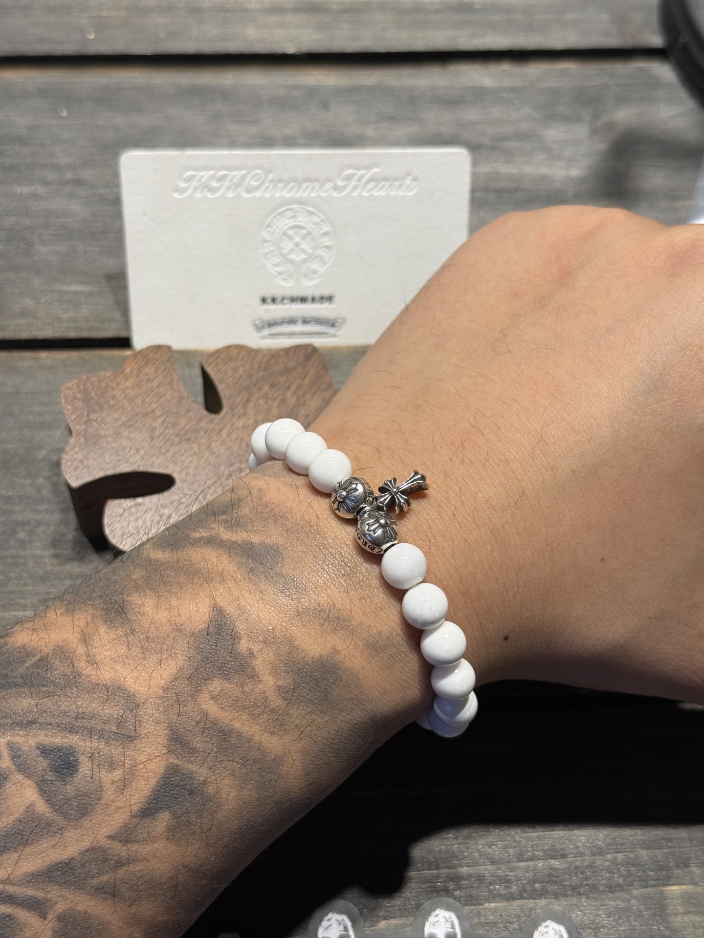 White agate cross silver bead bracelet available now.