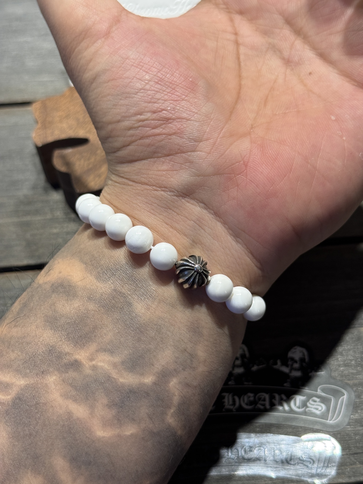 White agate cross silver bead bracelet available now.