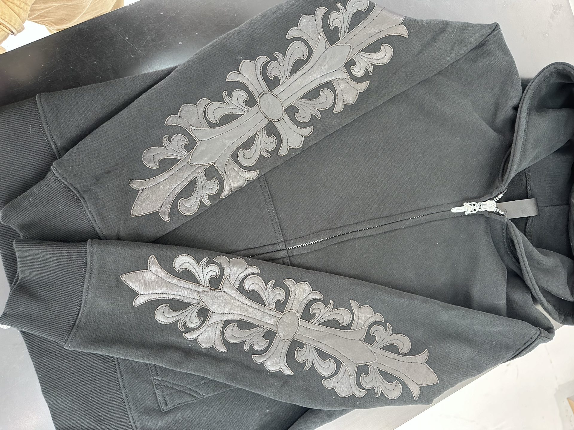 Chrome Hearts Black Handcrafted Double-Arm Vine-Patterned Leather Sweatshirt JacketSizes: XS-XLHardware: White Brass Plated Silver/925 Silver