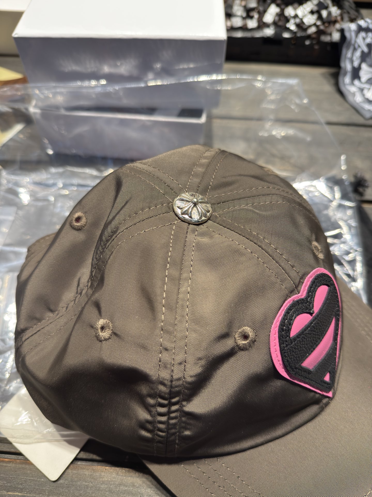 Custom-ordered heart-shaped baseball cap with exclusive D-ring buckle/cross top buckle + premium car emblem.