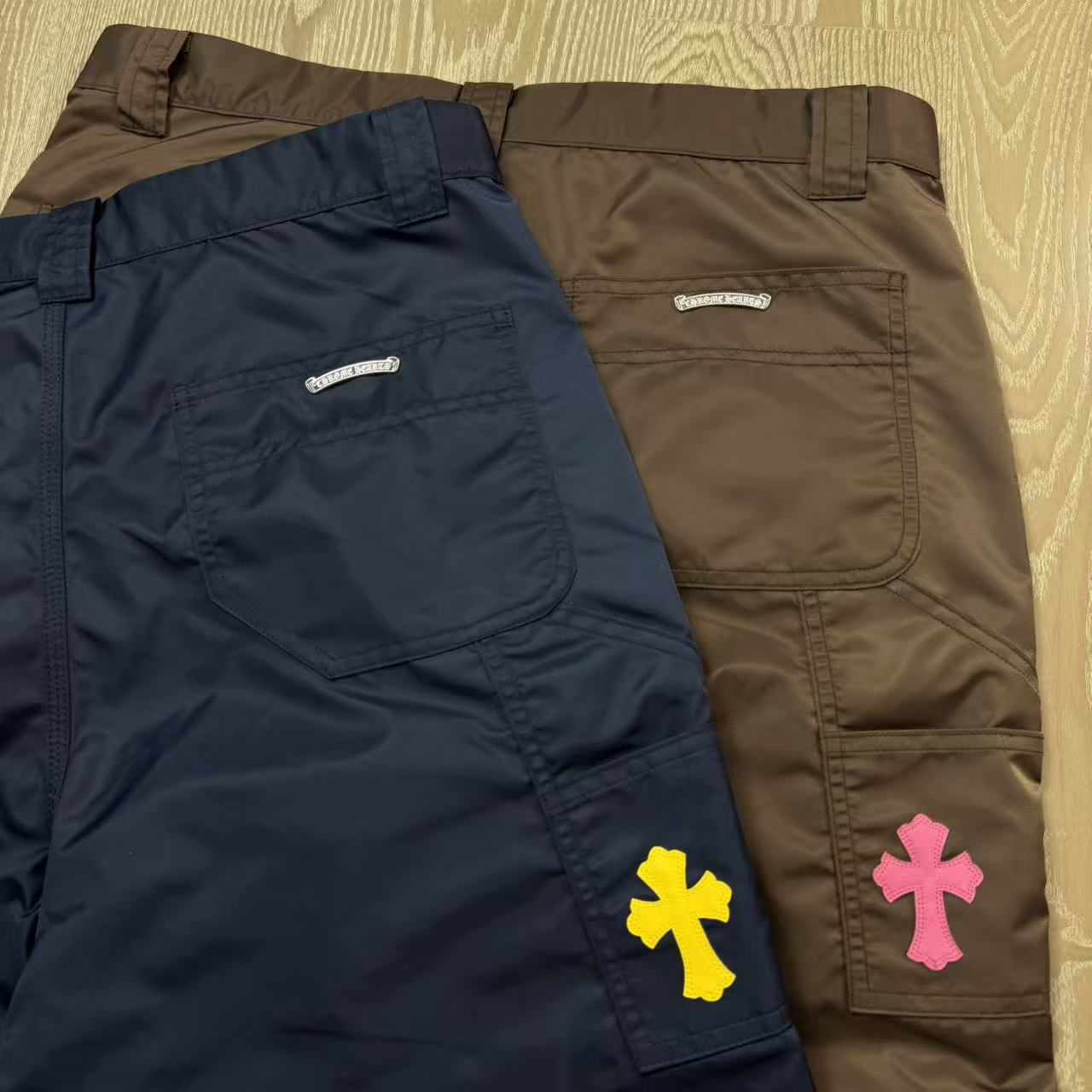 Chrome Hearts New Pants with Leather Patched and Logging FeaturesMatched design and color; silver-plated hardwareYellow leather cross on the backBoth knees are made from a single piece of leatherSizes 28, 30, 32, 34