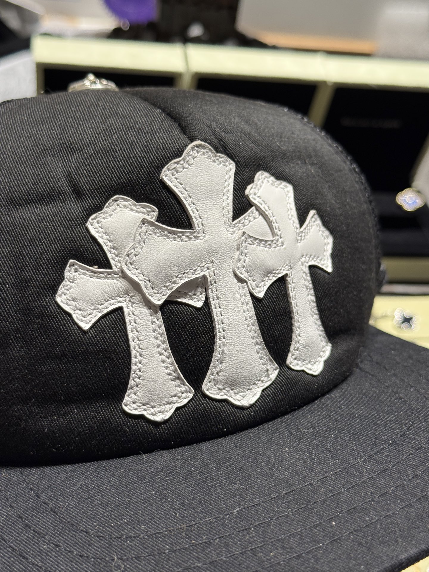 Custom-ordered 30-cross baseball cap with sterling silver buckle and premium car emblem.