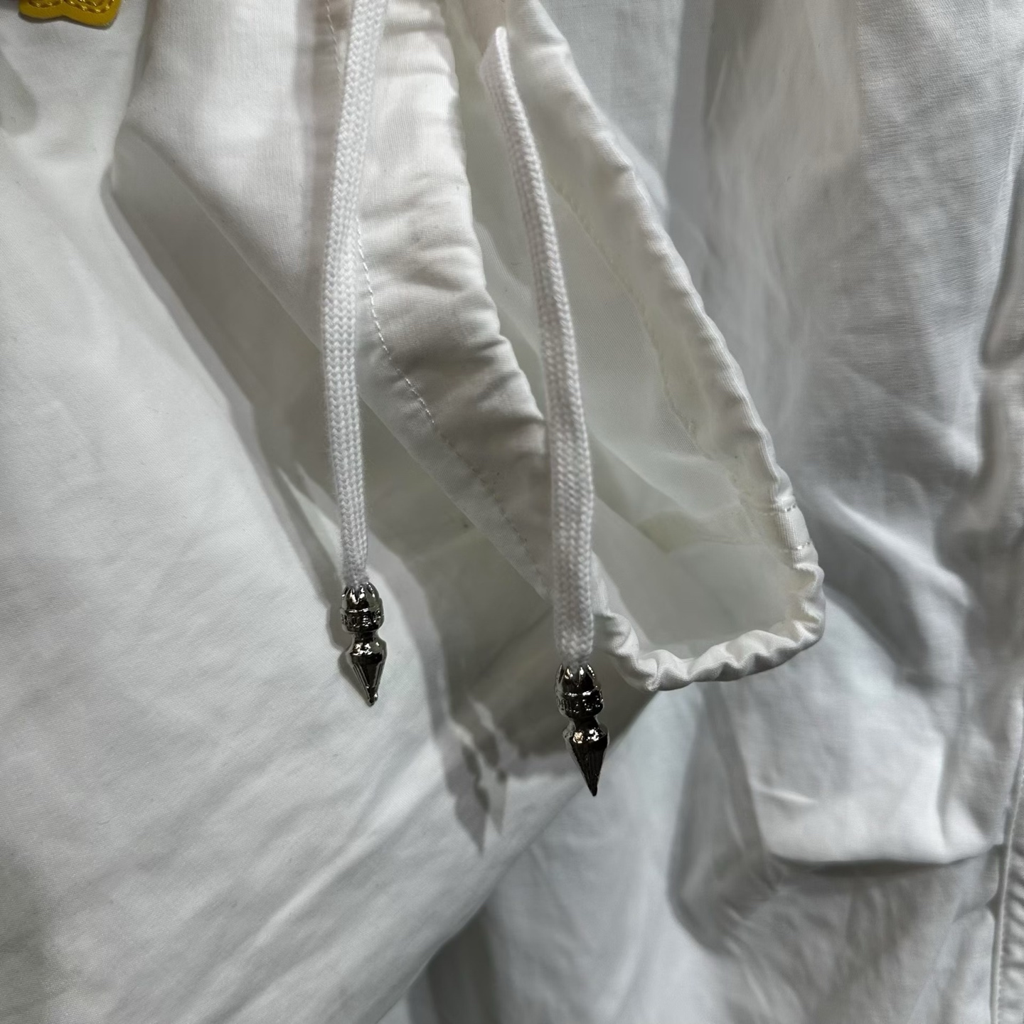 Chrome Hearts Heavyweight Paratrooper Pants with Colorful Crosses. A relaxed, laid-back fit, suitable for waist sizes 66-100cm. The fabric is custom-woven and dyed, requiring a carbon-brushed finish on the front followed by a brushed finish (resultin