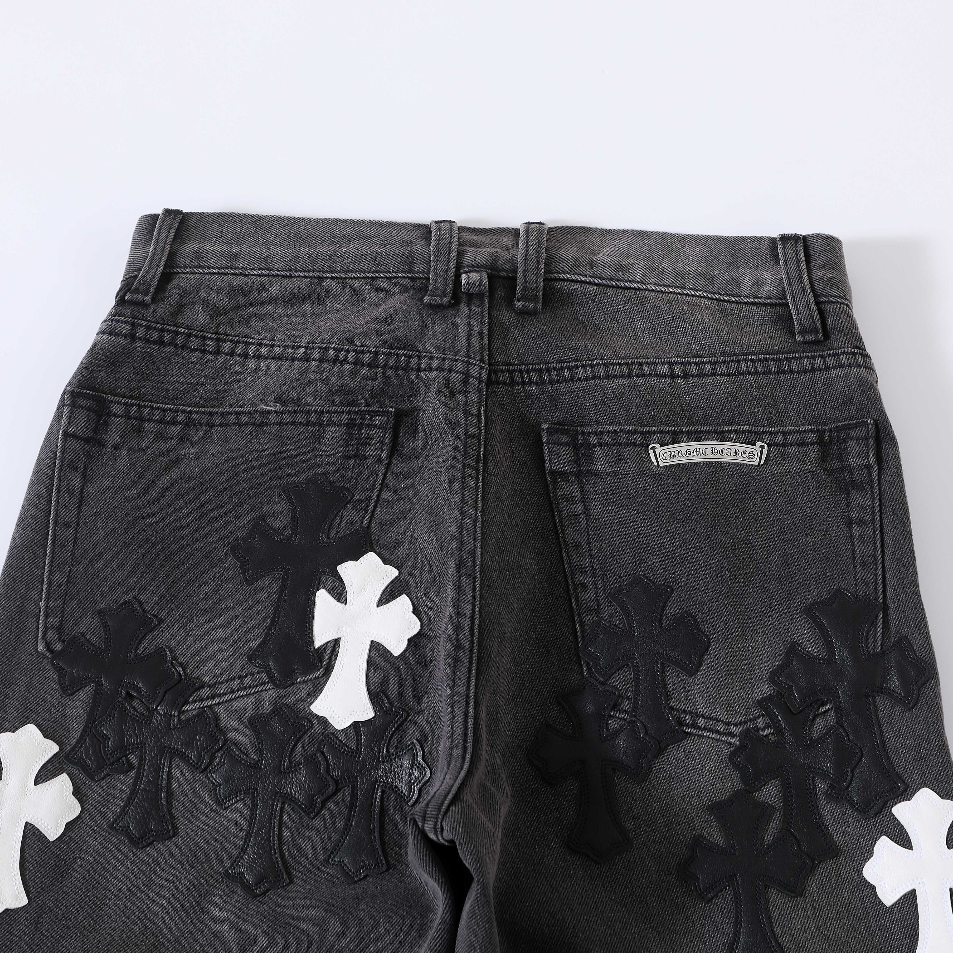 CH Flame Knee Design, Black and White Leather. Custom-made fabric, original jacquard lining, embroidery. Knee flame design perfectly replicated. Made with dozens of genuine leather crosses. Extremely high cost, significant wastage, and high labor cos