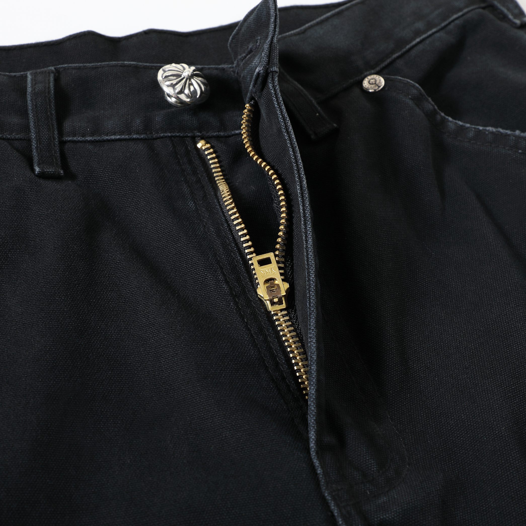 CH Distressed Carhart Style Work Pants with Green Leather PatchesThe fabric is a high-density, high-count, high-resin reactive black cotton Juvan.The fabric's high thread count and density give it a three-dimensional look.It's thick yet soft an