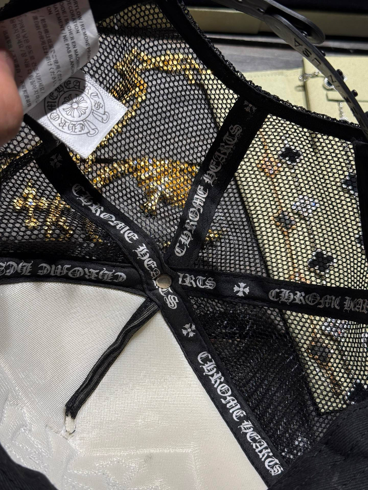 Custom-ordered 30-cross baseball cap with sterling silver buckle and premium car emblem.