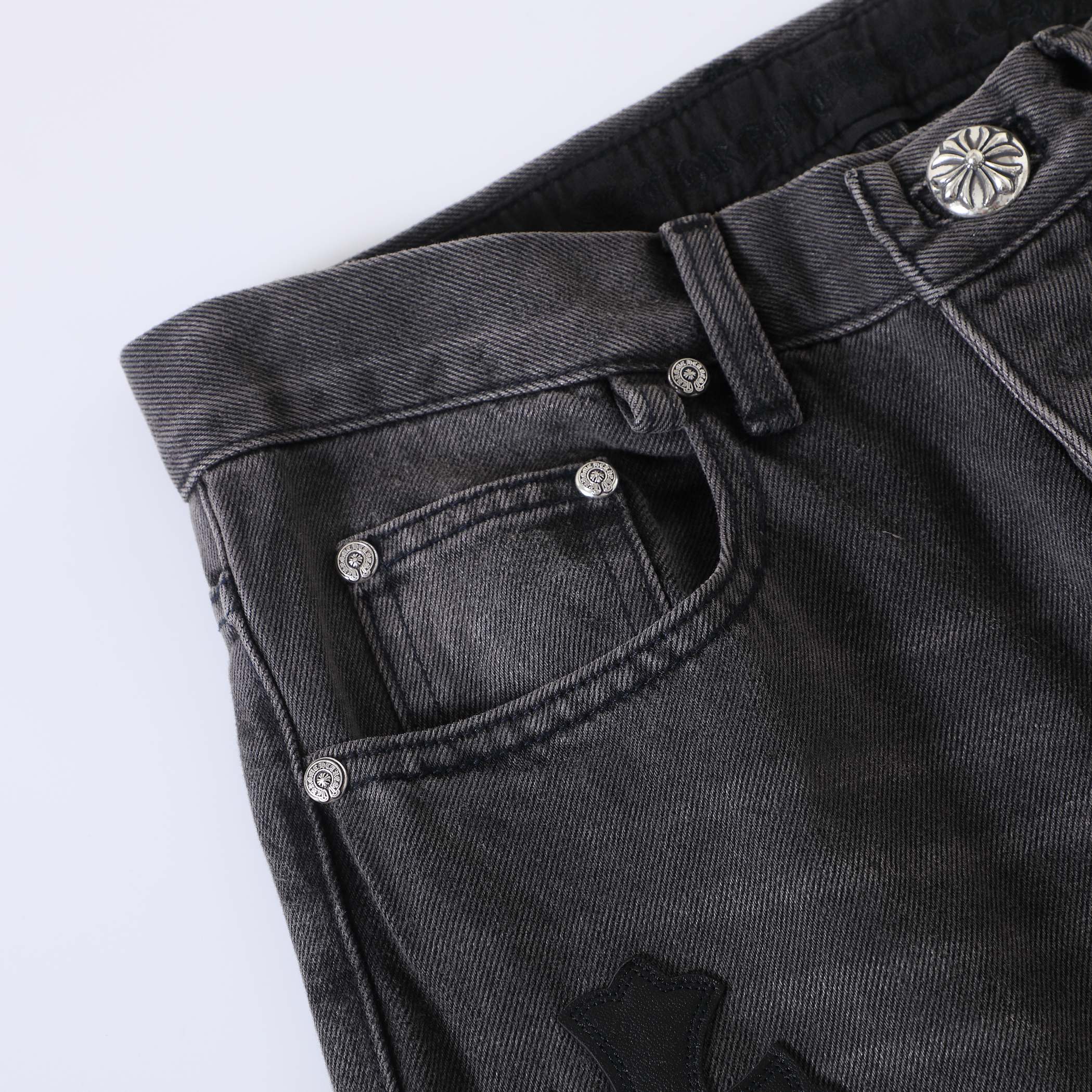 CH Flame Knee Design, Black and White Leather. Custom-made fabric, original jacquard lining, embroidery. Knee flame design perfectly replicated. Made with dozens of genuine leather crosses. Extremely high cost, significant wastage, and high labor cos