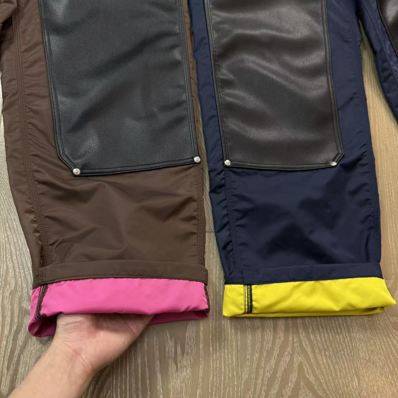 Chrome Hearts New Pants with Leather Patched and Color MatchingFeatures include silver-plated hardware.Pink leather cross on the back.Both knees are made from a single piece of leather.Sizes: 28, 30, 32, 34