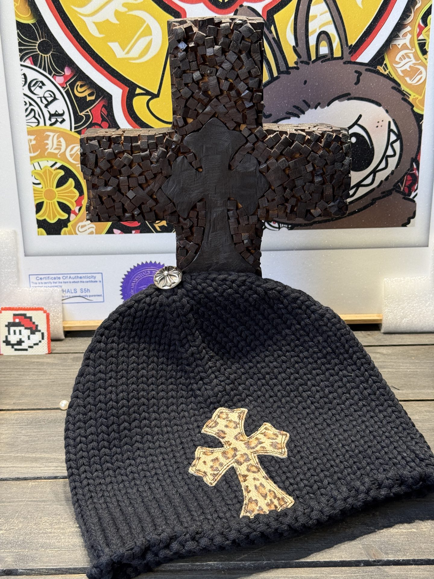 Custom-ordered leopard print cross beanie with sterling silver buckle and premium car emblem.