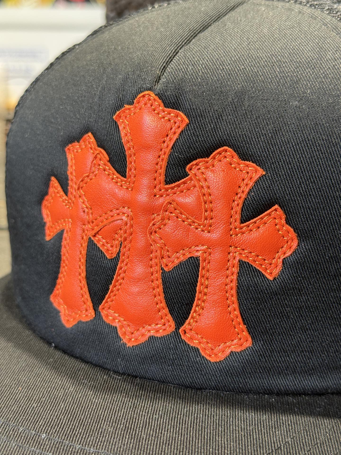 Custom-ordered 30-cross baseball cap with sterling silver buckle and premium car emblem.