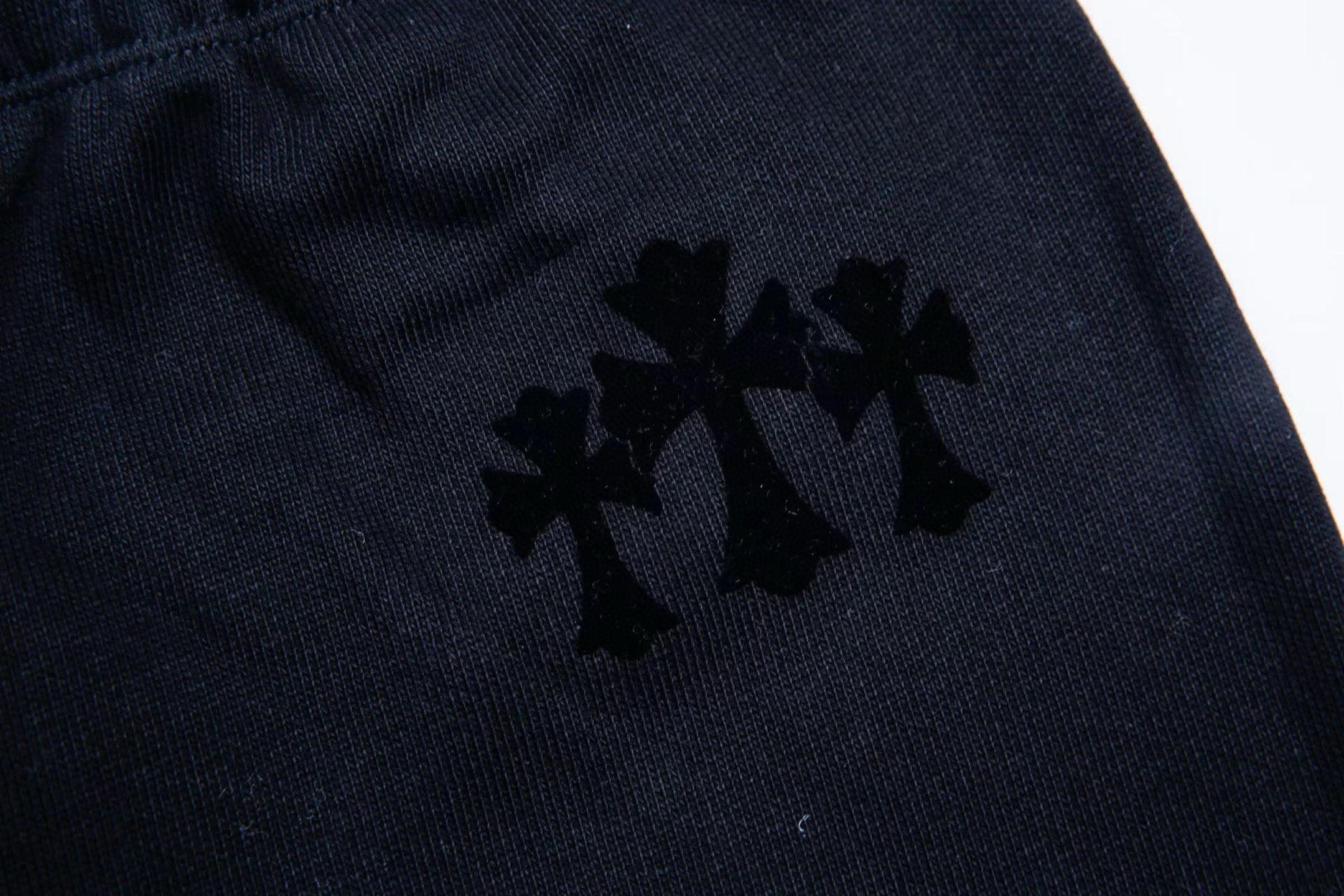 Chrome Hearts Grey Flocked Three Cross Casual Sweatpants. Custom-woven and dyed chunky knit loose fabric, segmented cut. Uses the same electrostatic flocking process as the finished garment, not the usual die-cut process; the color may vary depending