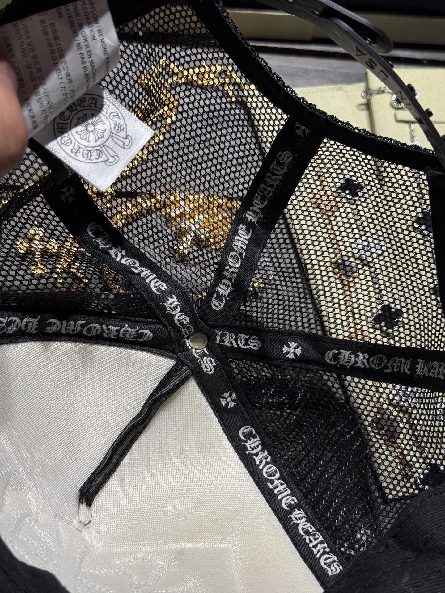 Custom-ordered 30-cross baseball cap with sterling silver buckle and premium car emblem.