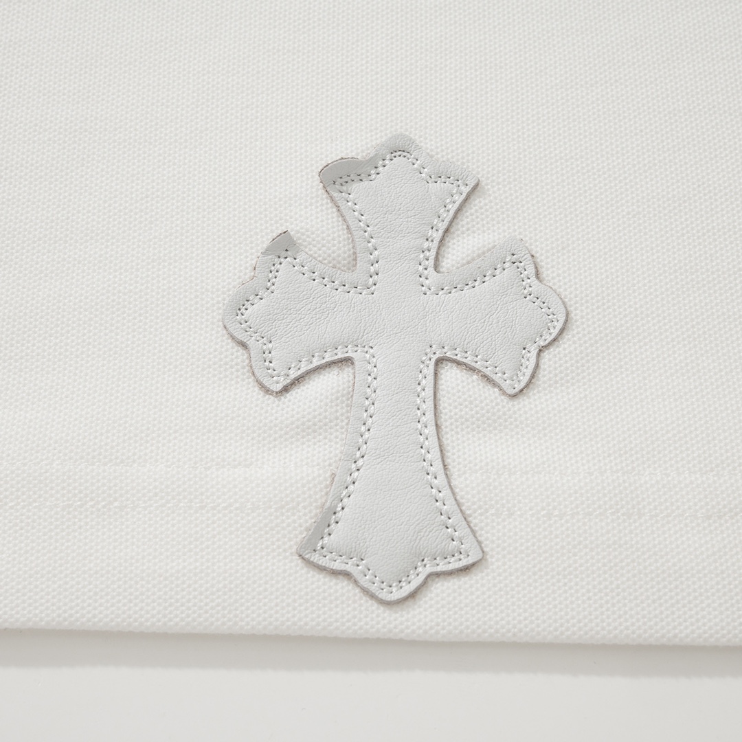 CH Chrome Hearts Exclusive Polo Shirt in Patchwork LeatherThe fabric is made of pique satin, incredibly smooth and comfortable against the skin with a cool feel. It features three top-grain cowhide cross panels on the front and back, and the neck la
