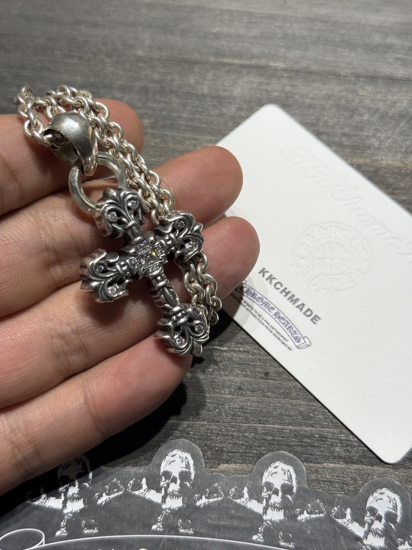 Custom-made for our client: Medium-sized flame cross necklace with full VVS diamond setting and lobster chain, featuring top-tier setting and engraving craftsmanship.